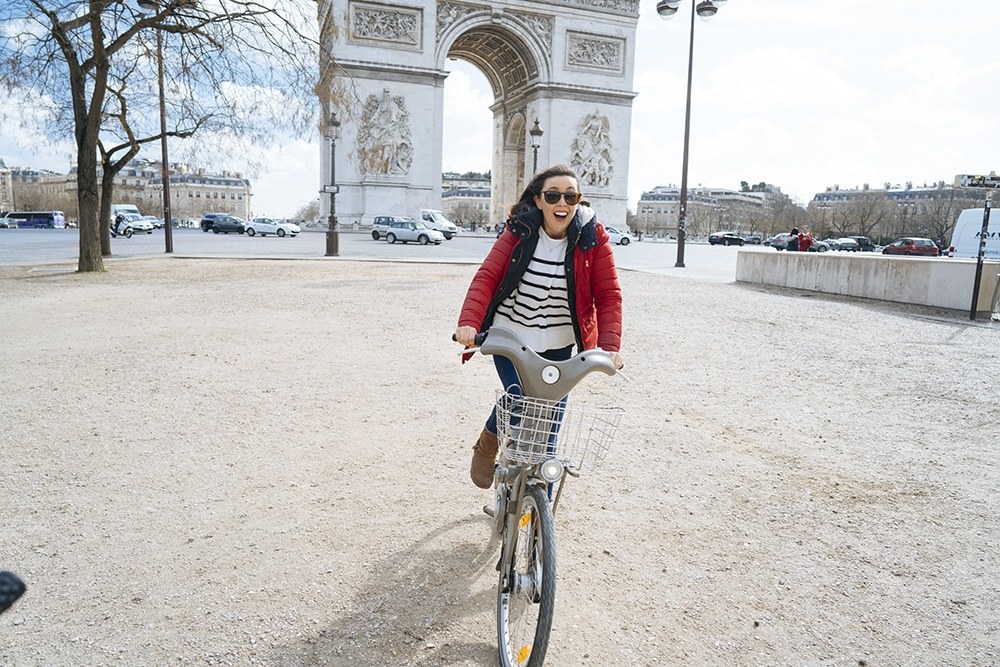 Paris with Kids Riding Bikes near the Arc de Triomphe