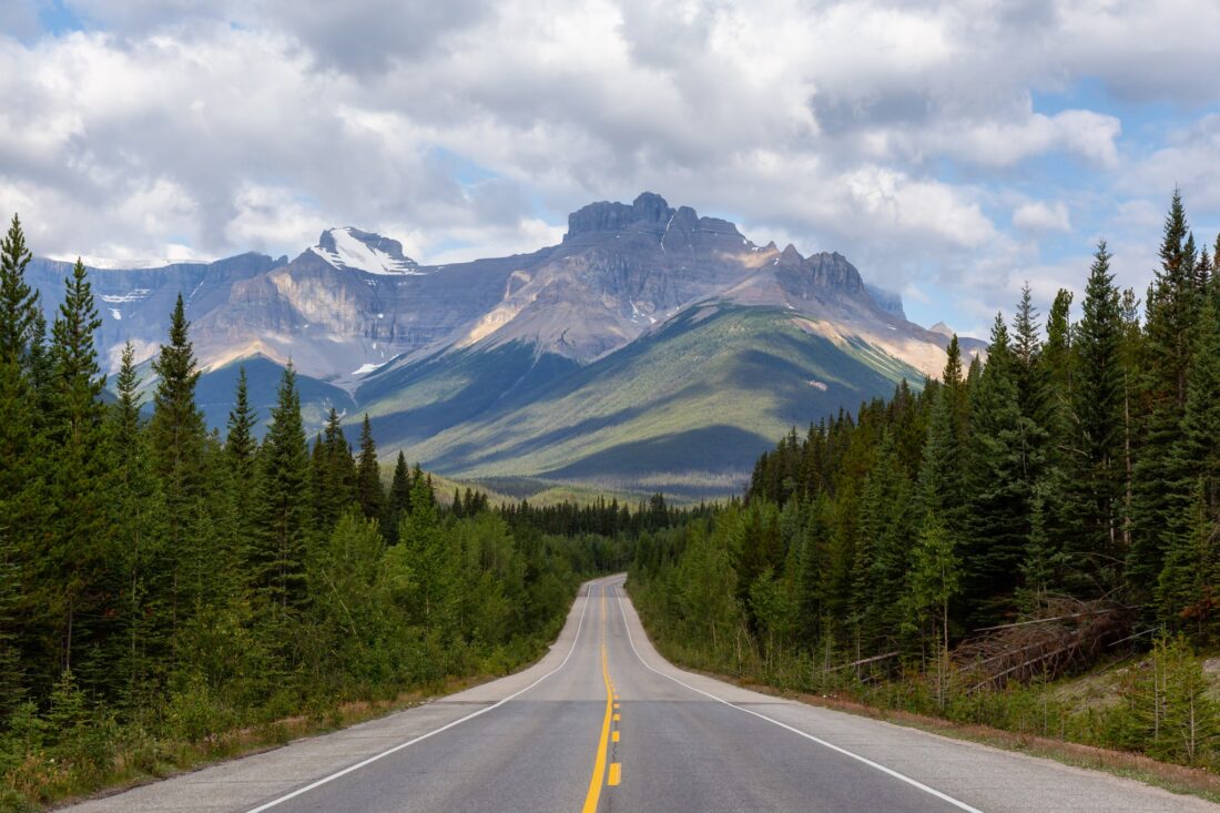 an empty road on icefields parkway national park alberta canada