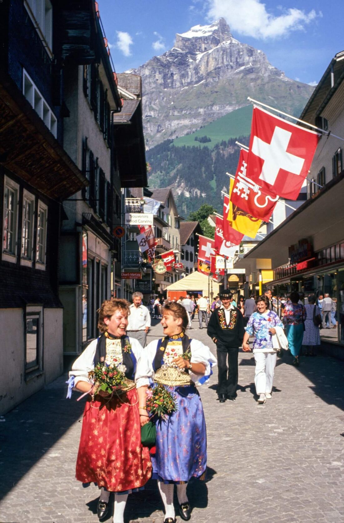 Women walking in traditional swiss clothing in Zermatt Switzerland