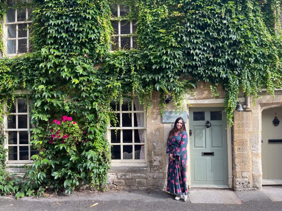 Most Beautiful Cotswolds Villages - woman standing in front of door in the Cotswolds