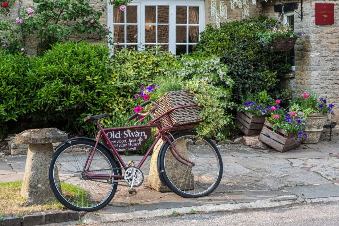 Most Beautiful Cotswolds Villages - a bike in front of a pub in minster lovell 